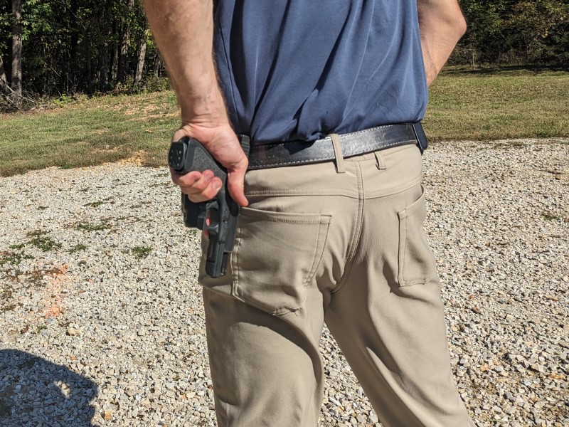 Using a handguns sights to rack the slide against a belt