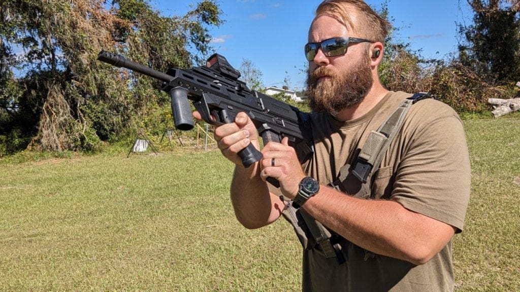 Man reloading rifle