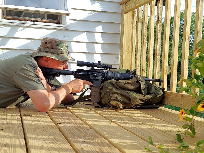 AR Carbine prone off a pack.