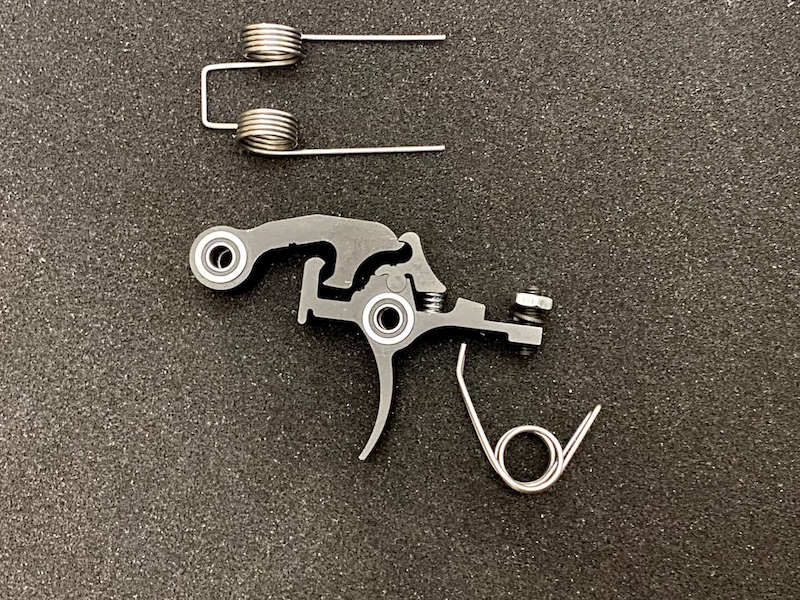 The Elftmann AK Trigger has two springs instead of one twisted spring. The reset is short and it breaks right at four pounds.