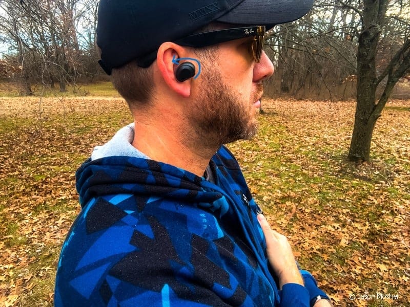 Putting on the XCOR earbuds.