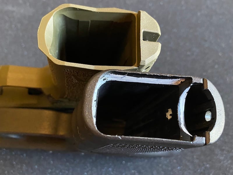 The mag wells on both are sufficient. The Arex has a bit more flare.