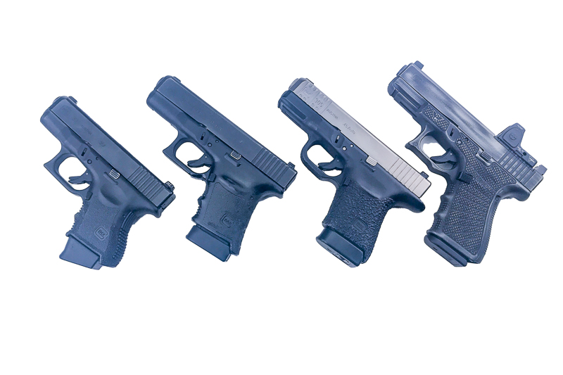 Four Glocks with different grip treatments.