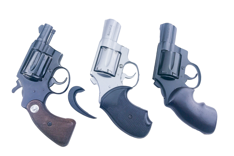 Three revolvers with different grips
