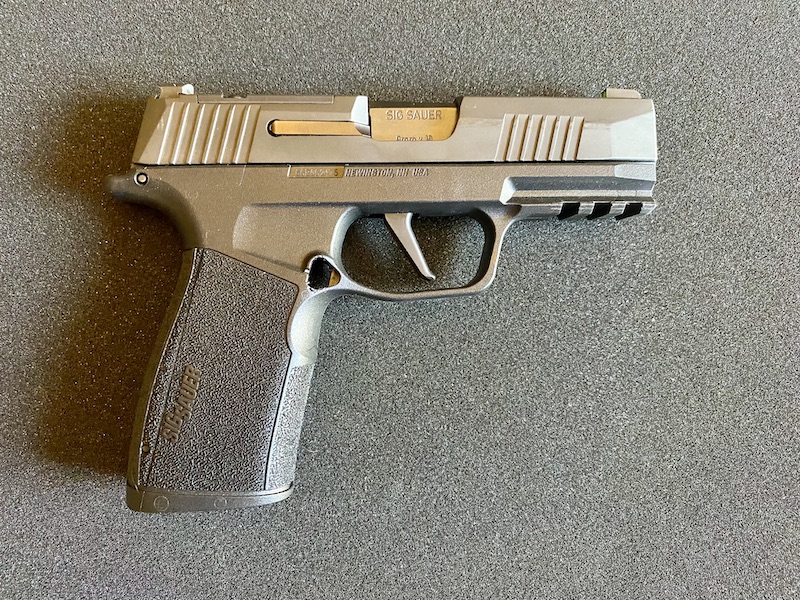 The Sig P365 Macro frame is slick above where your palm goes. This allows for the thumb to move freely to the mag release and slide stop levers. It also has a full picatinny rail.