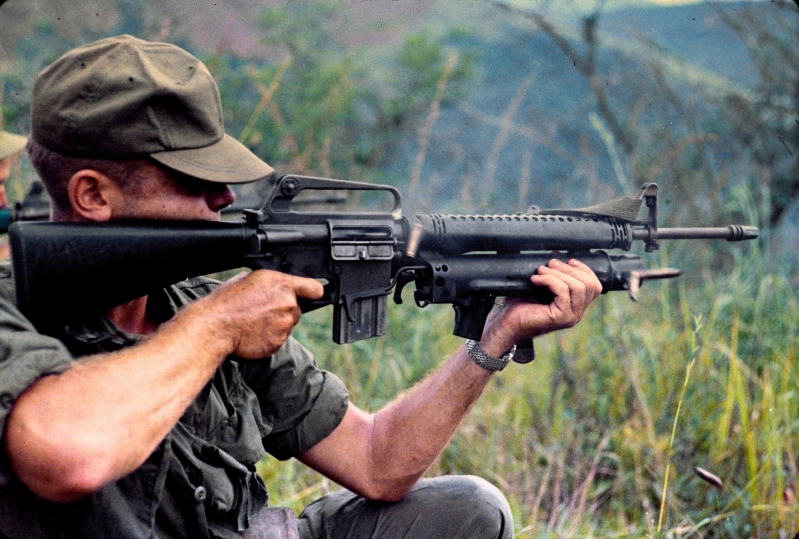 US Army soldier with XM-16E1 rifle and XM-148 grenade launcher in Vietnam.