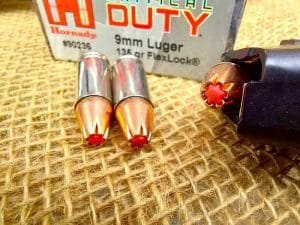 Hornady Critical Duty 9mm on table and in magazine